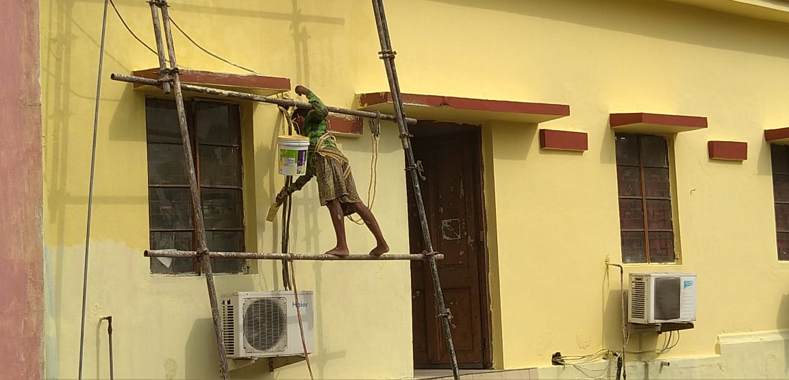The boy listening to songs and painting walls